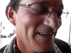 Old salesman blowing black cock in a hardware store