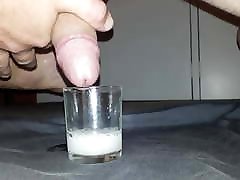 Cumming in small glass