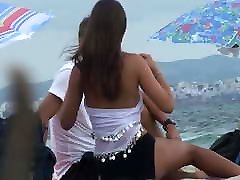 young busty brunette on the beach shows her boobs young busty brunette on the beach shows her boobs