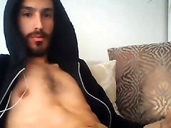 handsome muscled bearded guy jerking his big fat cut cock