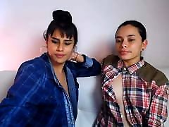 Latina lesbians Zoe and Lola play with each other’s tits
