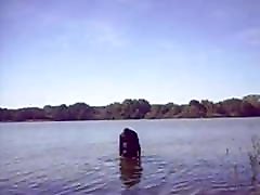 Swimming with PVC suit in the lake