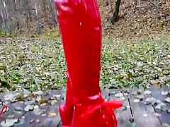 Lady L seachxhamster sleepin walking with extreme red boots in forest.