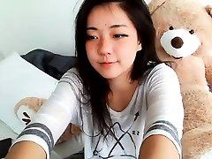 Shaved Asian milf squirting while masturbate on webcam