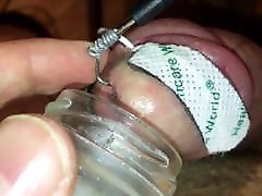 Extracting semen from heavily electro tortured cock