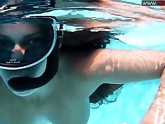Sexy chick Diana Kalgotkina swims naked in the skinny red head milf