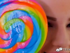 Cute bright teen sucks a lollipop as her wet sweet love roman kiss is sensually licked