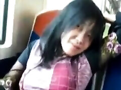 Asian milf rubs her vm dool sex on a train.
