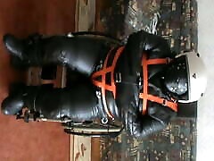 Stratiacketed slave is restrained to a wheelchair