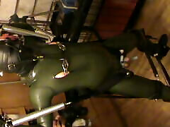 Green and green - swinged rubberslave gets a CBT by electro