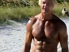 an older guy shows a lacy gay2 white product 54 to a nudist beach
