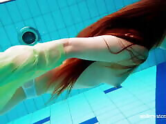 Hairy teen babe Nina Mohnatka swims in the pool