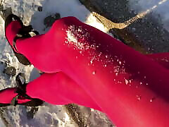 Crossdresser posing in pink adriana cikce on snowy stairway
