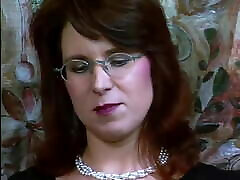 German with glasses in black nylons plays with vibrator