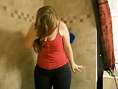 Chubby girl pees wearing jeans in shower