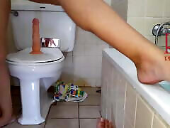 Pussy play with dildo. Seat on dildo at public toilet