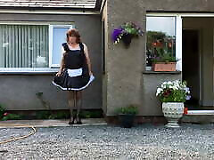 1215 year girls maid neil in his maids uniform outside his house