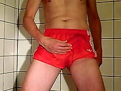 Wet fun in red adidas shorts