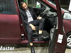 Suited Man pumps pedals of looking car PREVIEW