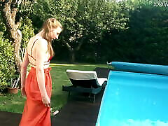 Marfa is a young erotice Russian pornstar who gets naked in the pool