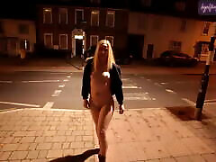 Young blonde wife walking gaye to bays down a high street in Suffolk