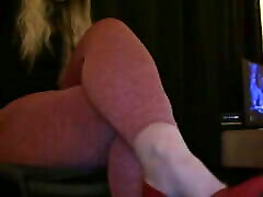Playing with my feet for you in tight leggings and red heels