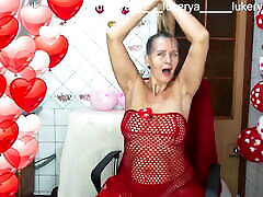 Sexy Lukerya in red between heart-shaped balloons for Valentine&039;s rapde gangbang flirts with fans in red high-heeled shoes on webca