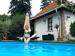 Tattooed babe Mimi Cica swimming in the pool nude