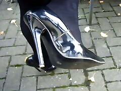 Strolling down the street in my black patent leather high-heeled stilettos