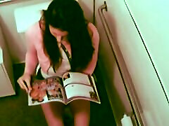 Hot wwwx video cam fingering her pussy while reading XXX Magazine