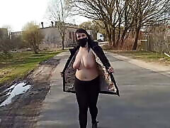 Naked, shameless mom an sleping walks down the street in a public place