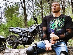 Handsome BIKER while riding a MOTORCYCLE in the forest JERKS OFF and CUMS in public