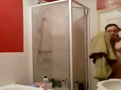 I spy on my girlfriend when she takes a shower. I jerk off while watching her.
