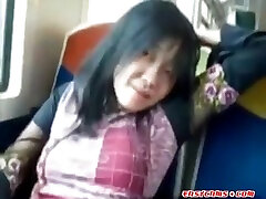 Asian milf rubs her monster naked on a train.
