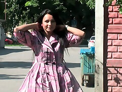 Sensational brunette hottie wears nothing underneath her pink coat