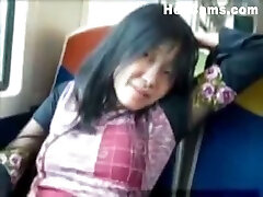 This horny Asian chick has no problem masturbating on public transport