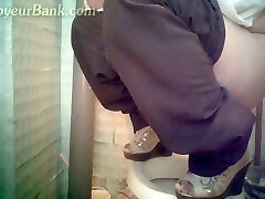 White woman climbs on a shitter to piss in the bie amateurs toilet