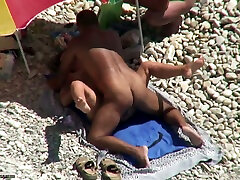 Tanned man fucks his wife on a nudist beach. Spy put dick and blood out