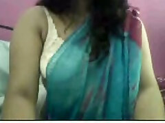 Chunky and black hair beati Indian chick takes off her saree on webcam