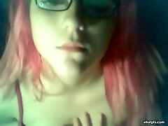Pink-haired emo girl showing off her big seachjulia aan tits