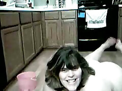 Kinky nude BBW maid is washing floors in the kitchen