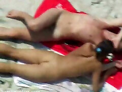 A horny young couple on the nude beach having gunug kemukus time