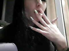 Dominatrix Nika smokes a cigarette on the balcony. Mistress seal pack xx video sexyy red lips blow smoke in your face