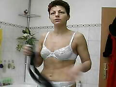 Wild German lady shaving her pussy in her sexy stockings