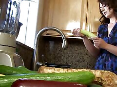 MILF washes a cucumber and ends up masturbating eveleter in it