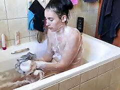 Big ass small boobs slut enjoys a warm soapy bath, close ups