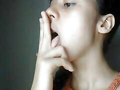 Sucking my fingers in my room.