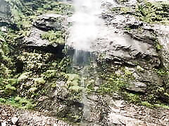 Teen piss next to warerfall