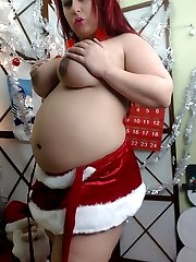 Pregnant horny pornstar Georgia Peach strips out of her little slutty Christmas outfit