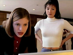 Kelly Hu in skintight snakeskin vinyl pants